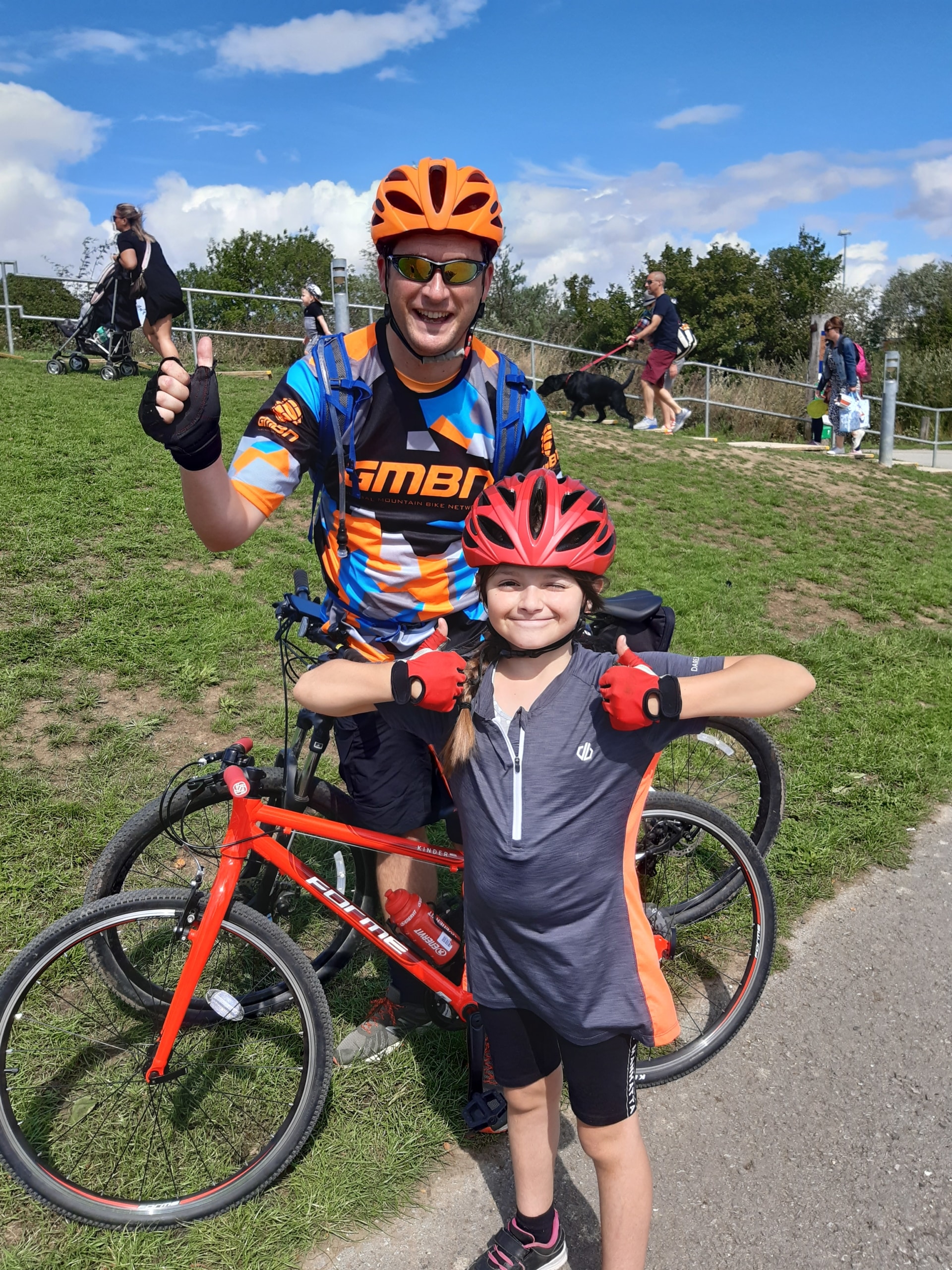 William Martin pupil, Rachel, and her father, smiling during the Marathon Cycling Challenge