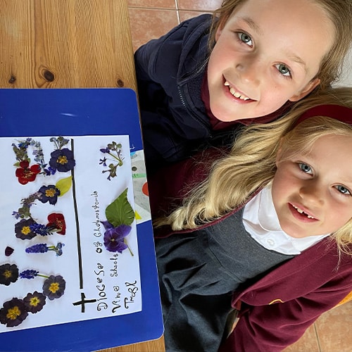Eleanor & Chloe from Ridgewell Church of England Primary School with their 'Runner Up' Vine Logo Competition Logo