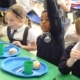 Pupils at Bulphan Primary in the school canteen