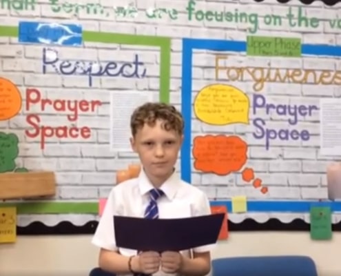 Pupil reading out a Vine Trust Staff Award