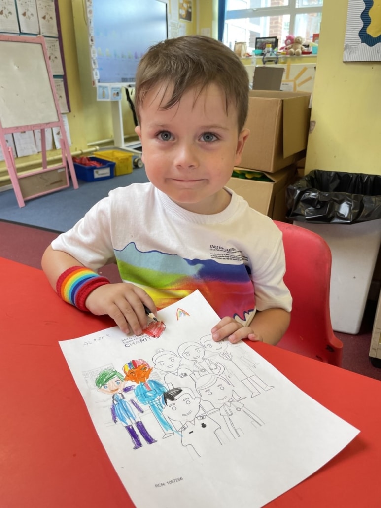 St Margaret's pupil with rainbow drawing